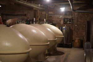 Domaine Didon uses ceramic barrels alongside traditional oak barrels and amphorae for fermentation and aging. 