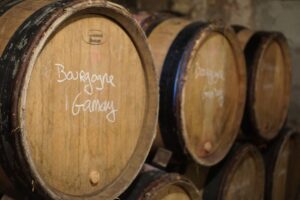 the wooden barrels in the cellar of domaine didon