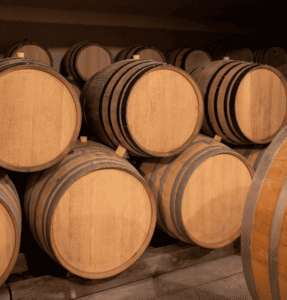 the beautiful oak barrels arranged nicely in the cellar of Anne et Jean-Francois Ganevat